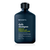 Woody's Daily Shampoo in a dark navy blue bottle with a black cap, on a white background with a soft reflection.