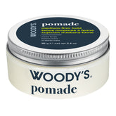 Woody's Pomade medium-firm hold hair wax in a round white plastic jar with a silver metal lid and a dark navy label.