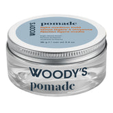 Woody's Pomade light-medium hold hair wax in a clear plastic jar with a silver metal lid and a light blue label.