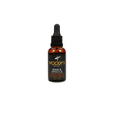 Woody’s Beard & Tattoo Oil Bottle with a dropper applicator for deep hydration and nourishment.