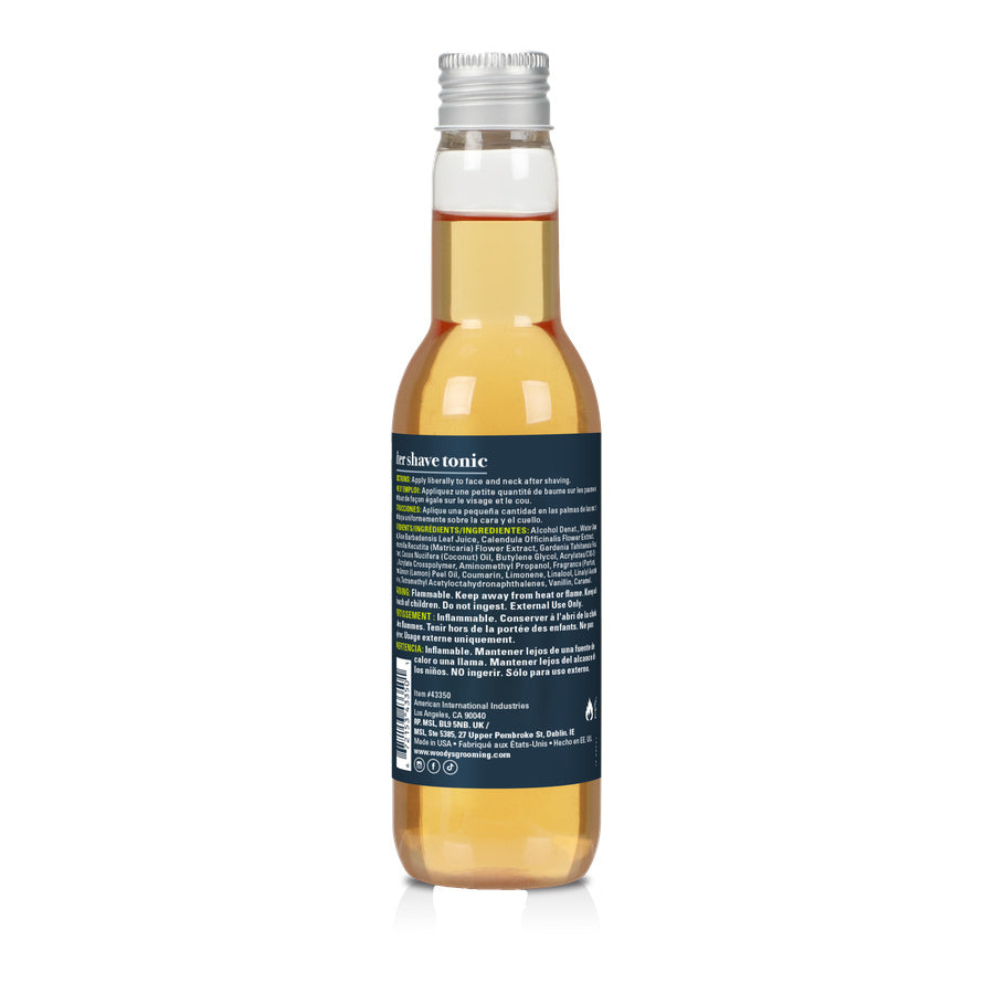 back of a bottle of after shave tonic on a white background