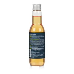 back of a bottle of after shave tonic on a white background