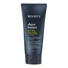 Woody's Shave Butter in a dark navy blue squeeze tube with white and yellow text, shown on a plain white background.