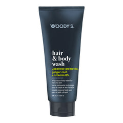 Woody's Hair & Body Wash in a dark navy blue squeeze tube with white and yellow text, on a plain white background.