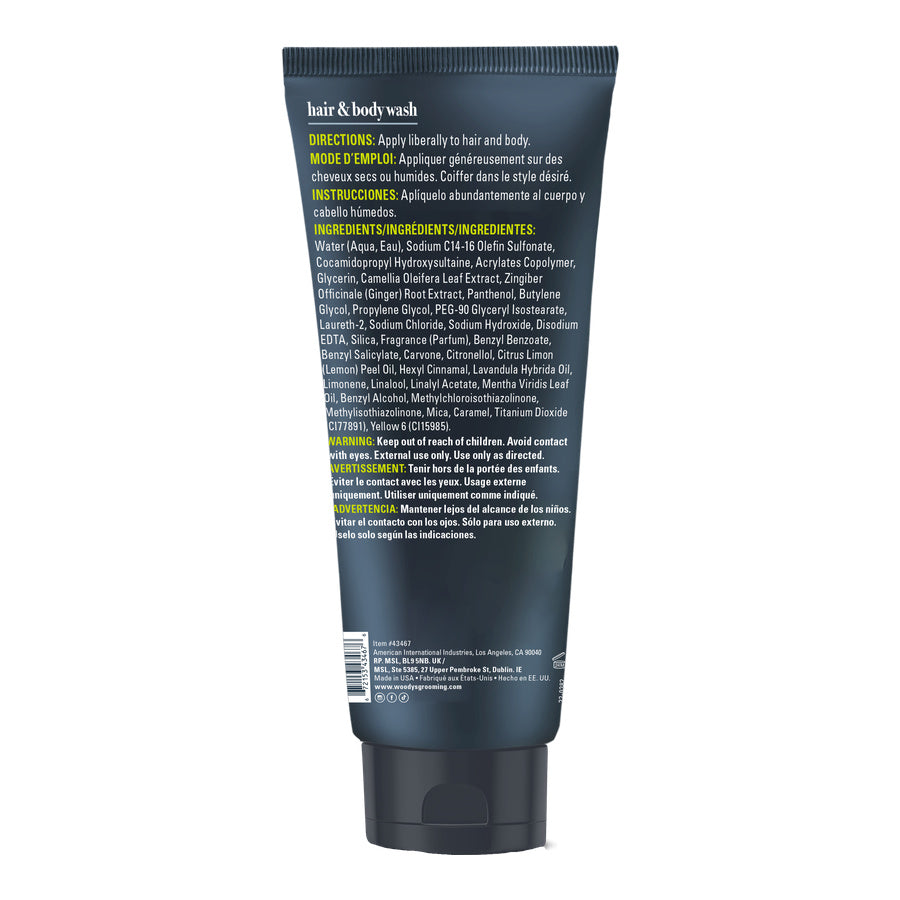 A single tube of hair and body wash shown from the back on a plain white background. The tube is dark navy blue with white and yellow text detailing the ingredients and directions.