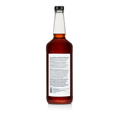 Back of bottle of Woody's 3-in-1 Shampoo, Conditioner, and Body Wash with a white label