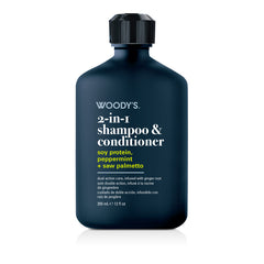 Woody's 2-in-1 shampoo & conditioner bottle in a dark navy blue color with white and yellow text, on a clean white background.