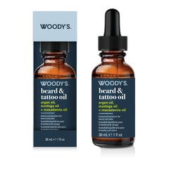Woody's Beard & Tattoo Oil 30 mL amber glass dropper bottle shown next to its retail box on a white background.