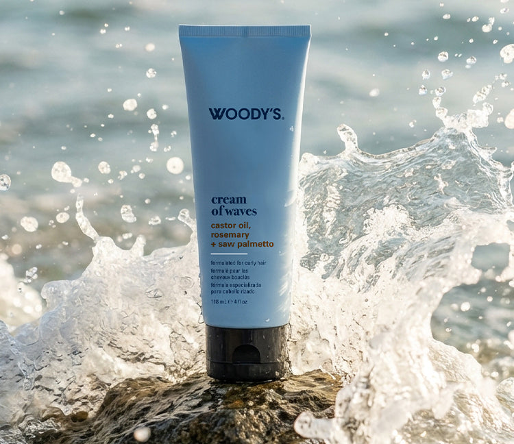 Woody’s cream of waves tube container with an ocean wave crashing in the background.